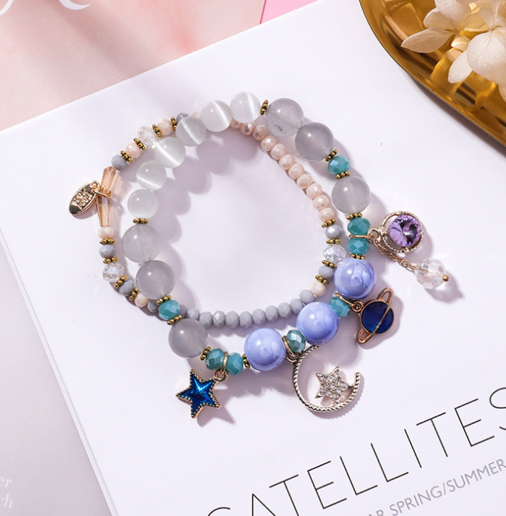 Crystal Bracelet with Star, Moon, and Cat Eye Design