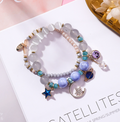 Crystal Bracelet with Star, Moon, and Cat Eye Design