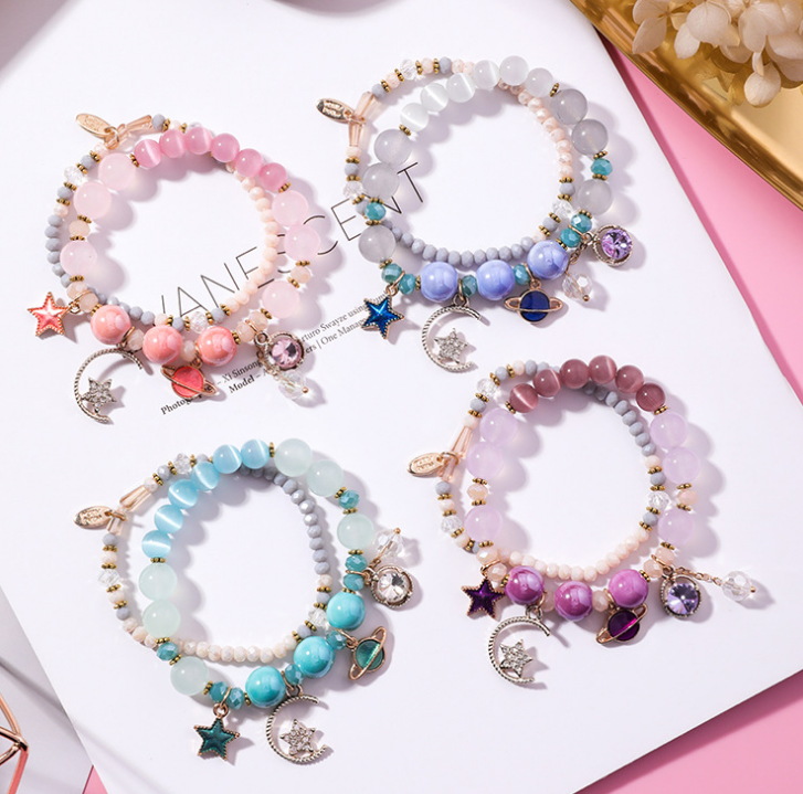 Crystal Bracelet with Star, Moon, and Cat Eye Design